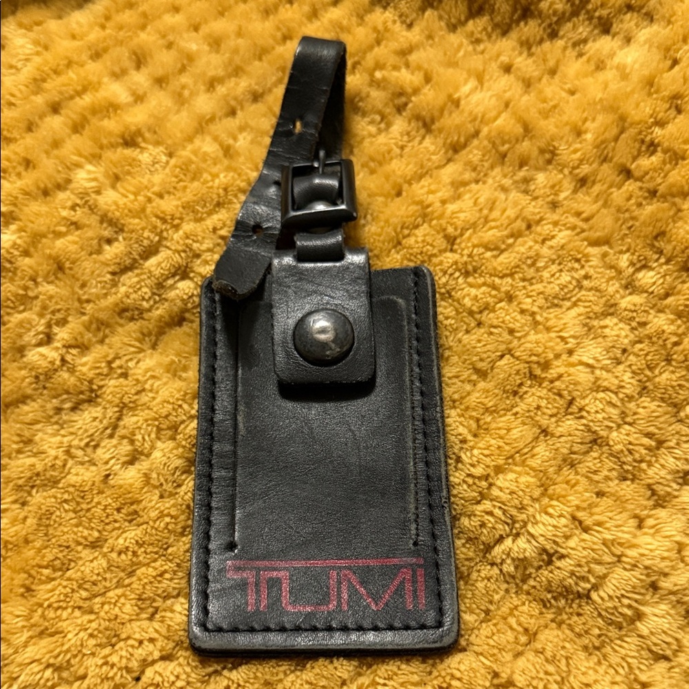 Tumi Black Leather Luggage Tag with Red Logo Accent